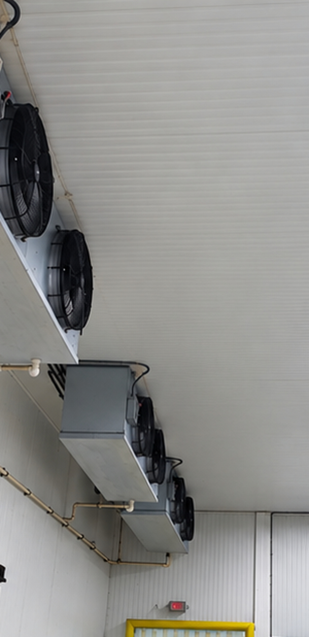 Multiple commercial refrigeration evaporators serving a cold room