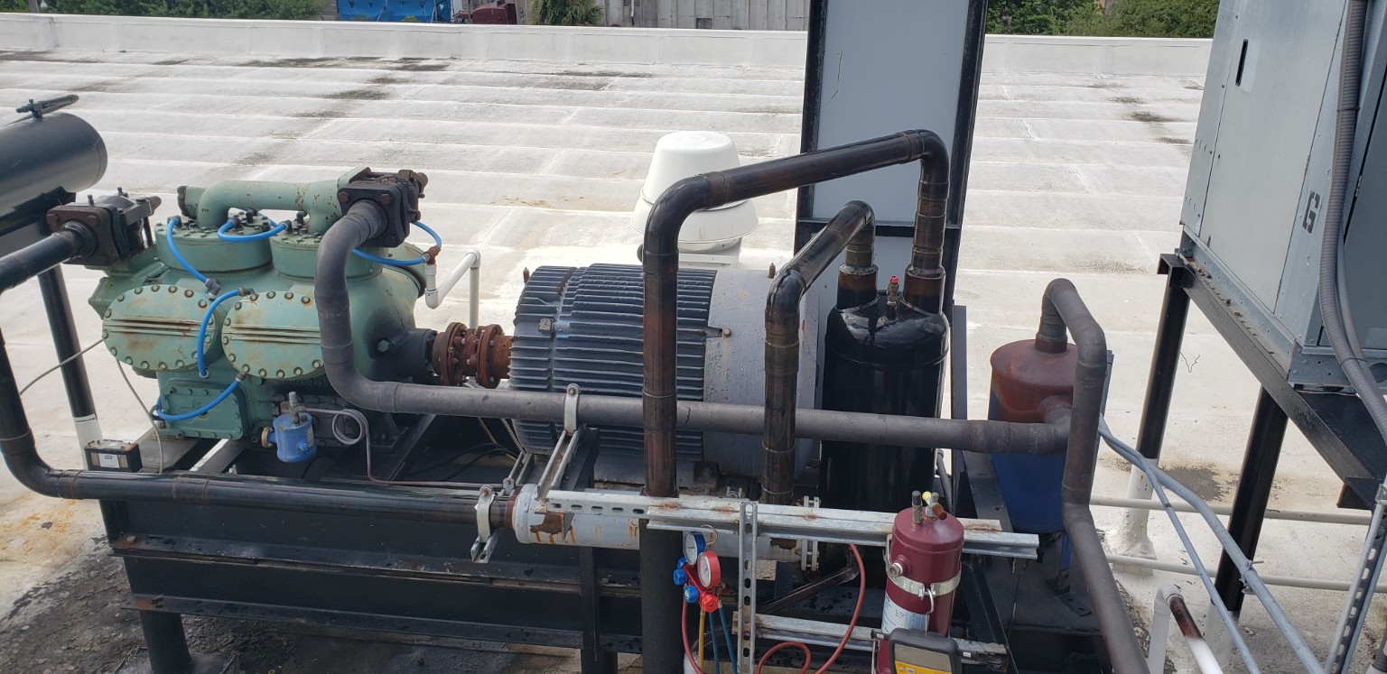 Carrier 5H-126 open-drive compressor system with water-cooled compressor head, motor drive, piping and associated components