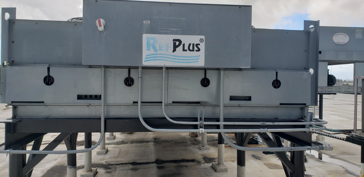 Large remote air cooled condenser serving North Star M-40 industrial flake ice machine